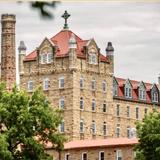 Subiaco Academy Photo - Named by Architecture Digest as one of "The World's Most Beautiful vlog Schools," the modified Romanesque style architecture was rebuilt in 1959 using native sandstone taken from our own quarries about a mile northeast of the Abbey.