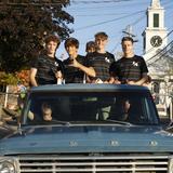 Lincoln Academy Photo #9 - Homecoming is a whole community event, with a parade between the town and the school! Here, boys on the soccer team wave to the crowd.