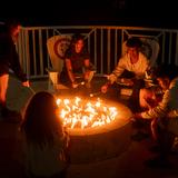 Saint Andrew's School Photo #7 - Residential Life students making s'mores at the fire pit at the head of the school's house.